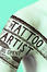<span class='translatable' lang='Cover of '{[title]}''>Cover of 'The Tattoo Artist'</span>